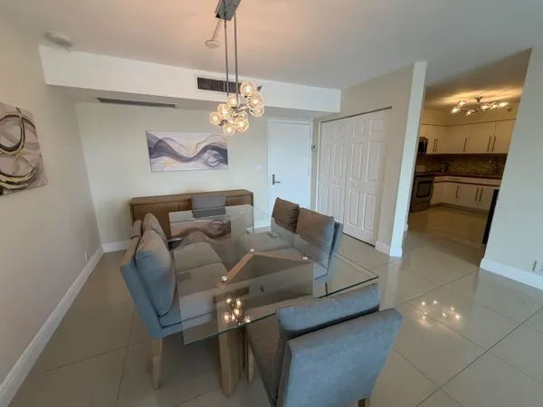 a view of a livingroom with furniture and a chandelier