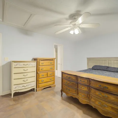 a room with furniture and a dresser