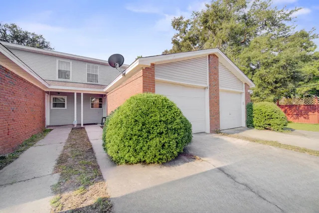 front view of a house with a small yard