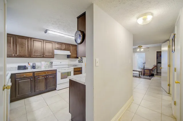 a kitchen with a sink cabinets and appliances