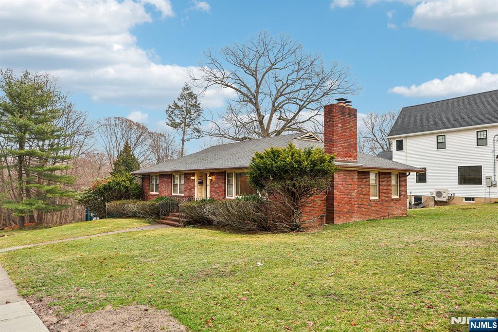 84 Squaw Brook Road North Haledon, NJ 07508 - Photo 1 of 23 a front view of house with yard and green space