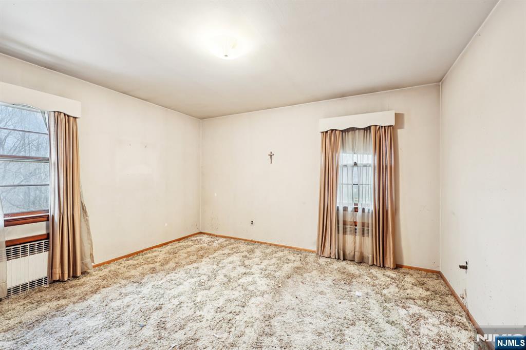 84 Squaw Brook Road North Haledon, NJ 07508 - Photo 11 of 23 an empty room with a natural light