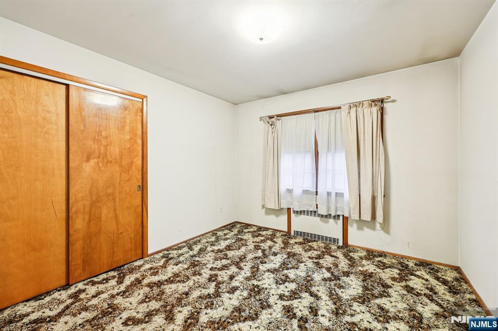 84 Squaw Brook Road North Haledon, NJ 07508 - Photo 15 of 23 a bedroom with a bed and a window