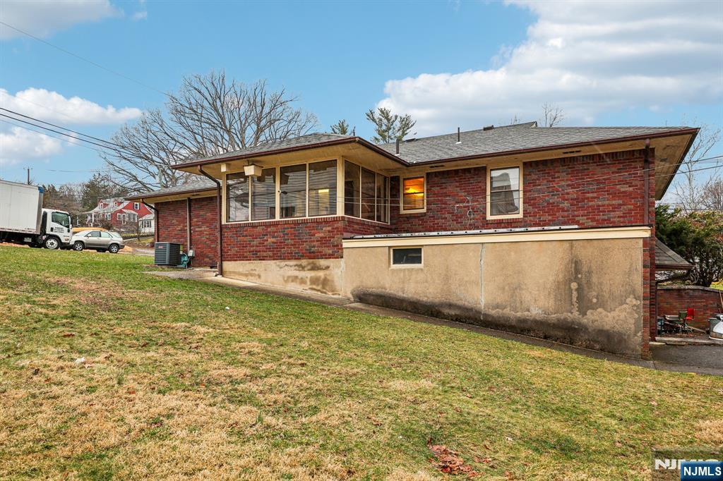 84 Squaw Brook Road North Haledon, NJ 07508 - Photo 20 of 23 a front view of a house with a yard