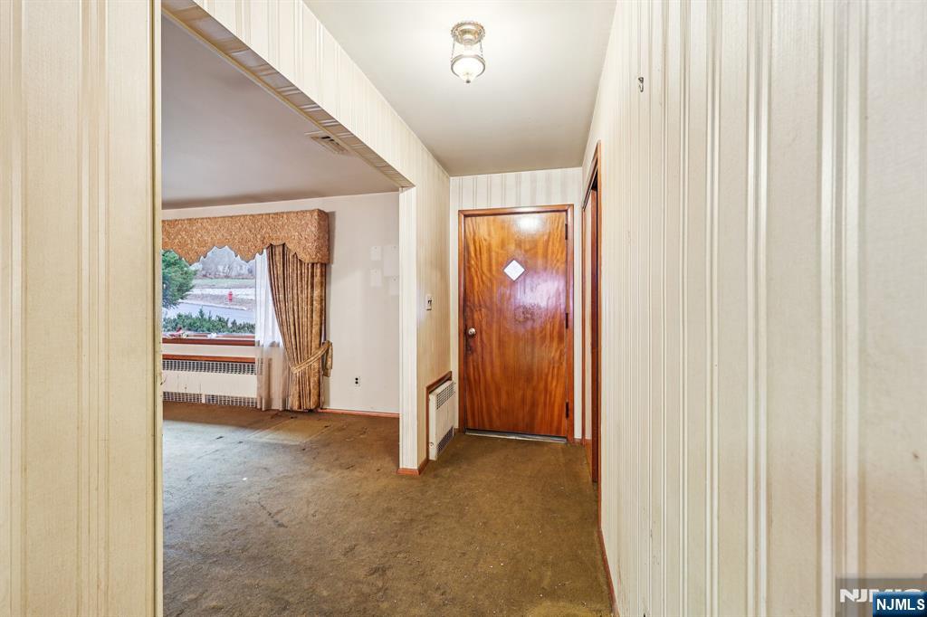 84 Squaw Brook Road North Haledon, NJ 07508 - Photo 2 of 23 a view of an empty room and a window