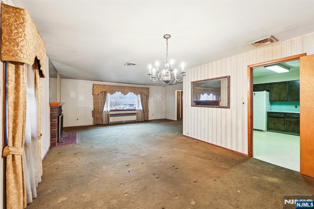 84 Squaw Brook Road North Haledon, NJ 07508 - Photo 6 of 23 a view of a big room with windows and chandelier