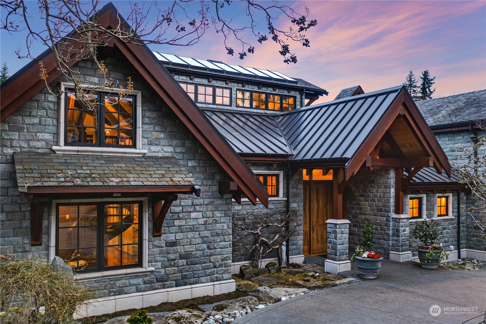 a front view of a house with garage