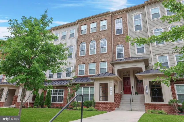 a front view of a building with garden