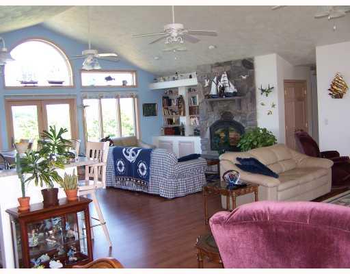 283 River Hill Road Templeton, PA 16259 - Photo 2 of 7 Den/Family/Great Room. 32 x 28 with open floor plan that leads into kitchen and livingroom. High efficiency woodburning fireplace with built-in bookcases and log storage area. Vaulted ceiling with incredible view.