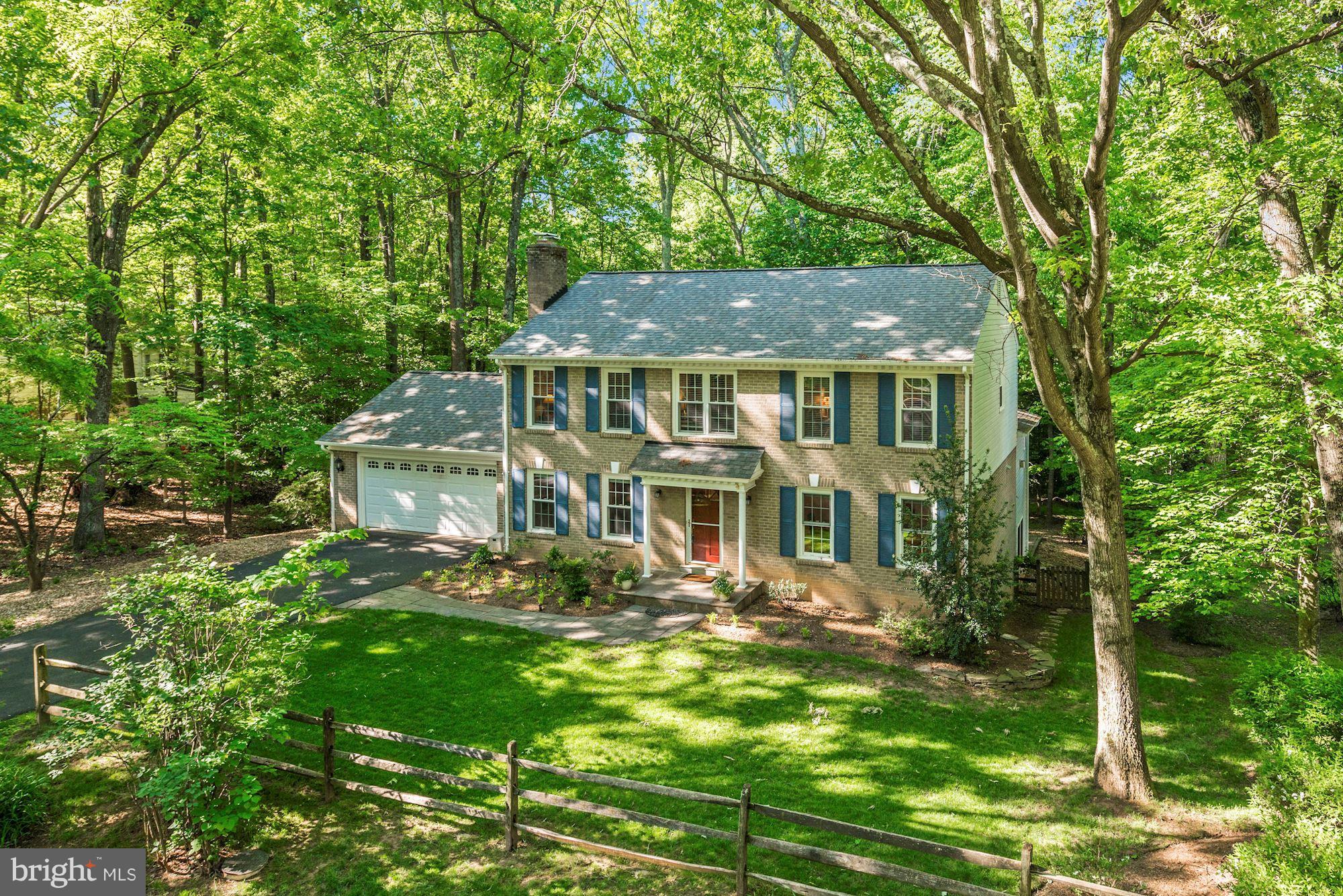 11603 Clipstone Lane Reston, VA 20191 - Photo 1 of 30 a front view of a house with garden