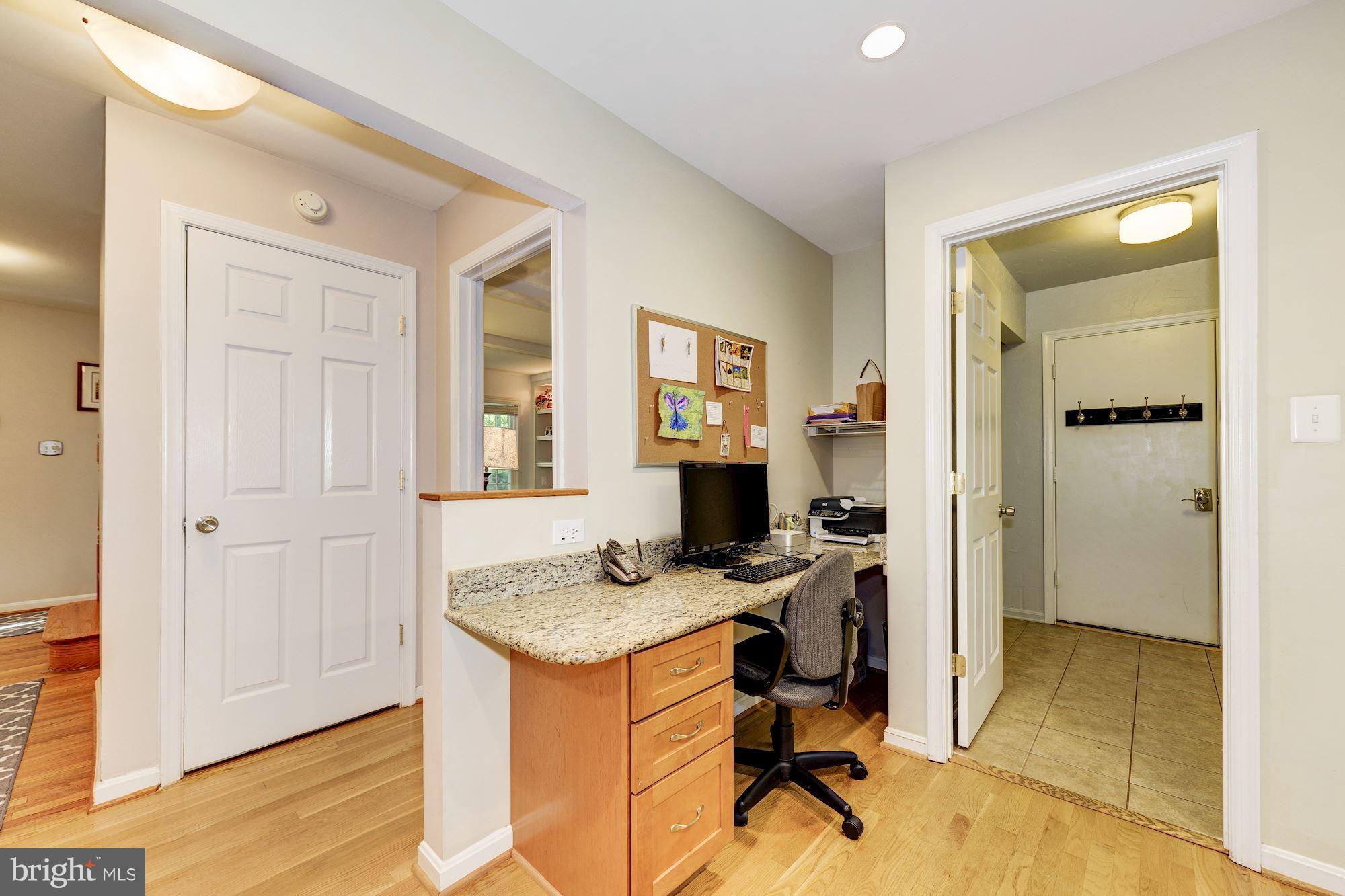 11603 Clipstone Lane Reston, VA 20191 - Photo 12 of 30 a view of a workspace with furniture and a window