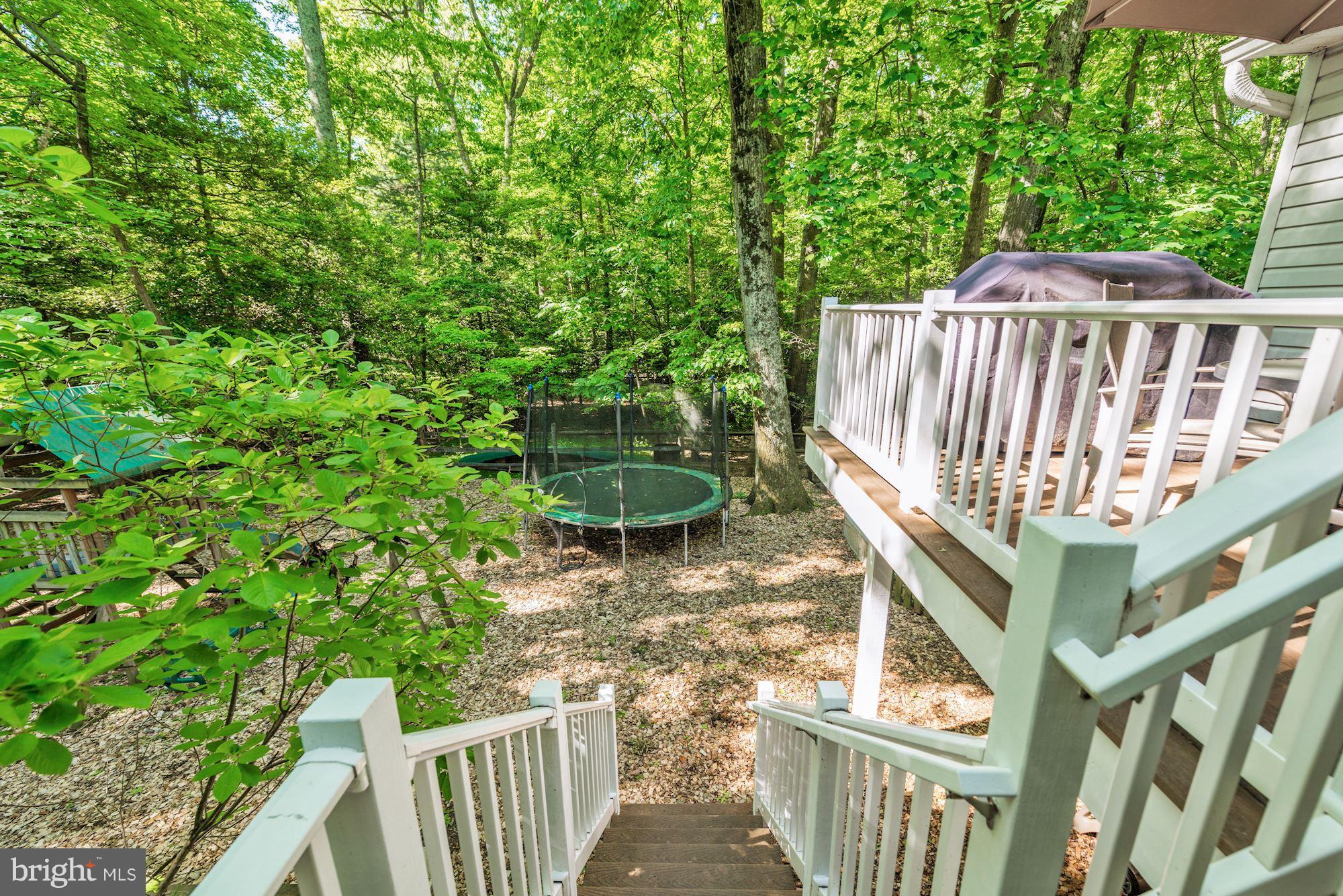 11603 Clipstone Lane Reston, VA 20191 - Photo 26 of 30 a view of outdoor space with deck and garden