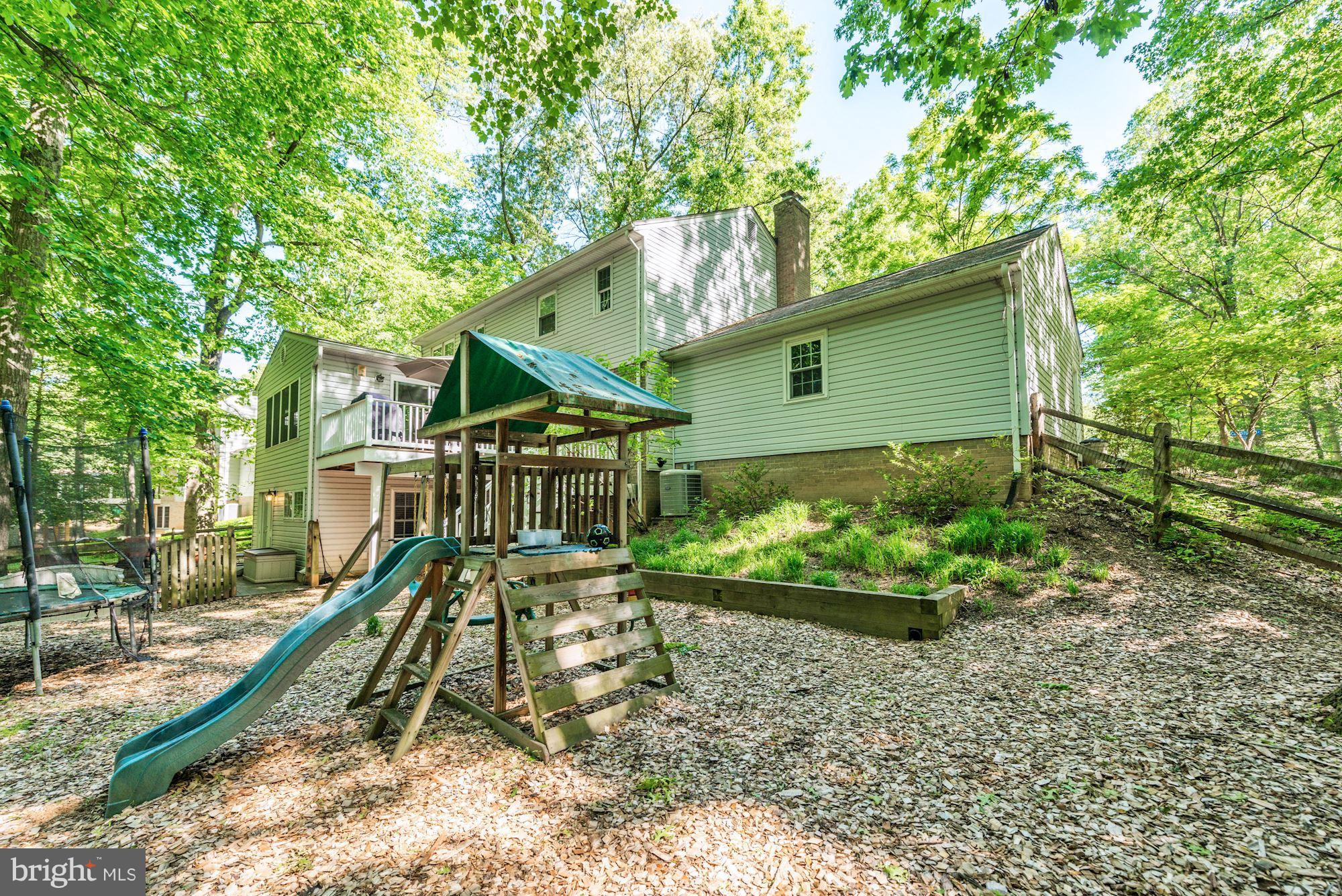 11603 Clipstone Lane Reston, VA 20191 - Photo 28 of 30 a front view of a house with a yard