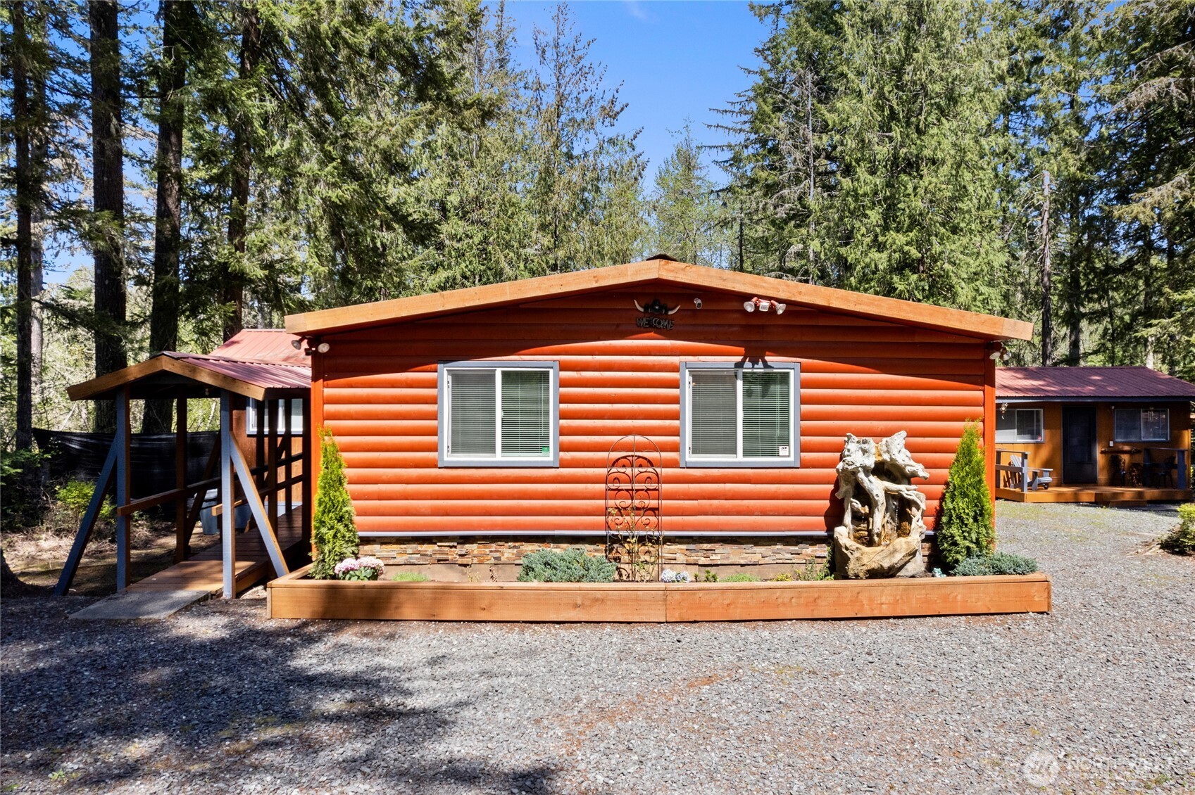 271 Skate Creek Road North Ashford, WA 98304 - Photo 2 of 40 a front view of a house with a yard