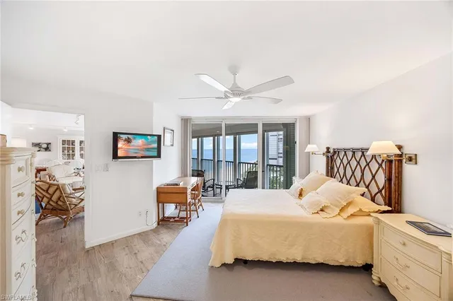 a bed room with a bed and a chair