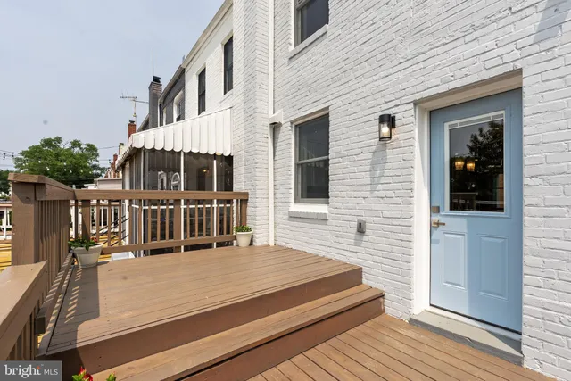 a view of a balcony with wooden floor