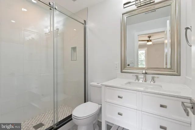 a bathroom with a shower and a sink