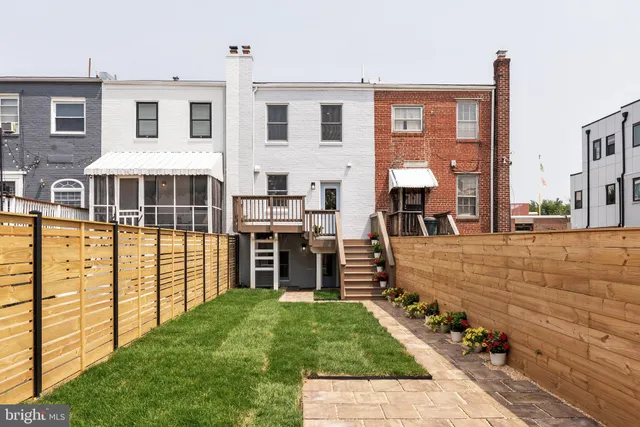 a view of balcony with a yard