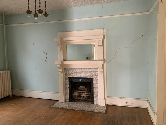 a living room with a fireplace