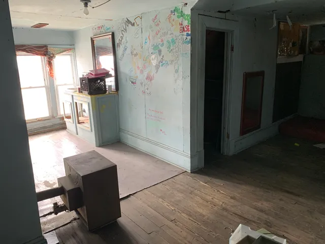 a kitchen with stainless steel appliances kitchen island granite countertop a refrigerator and a stove