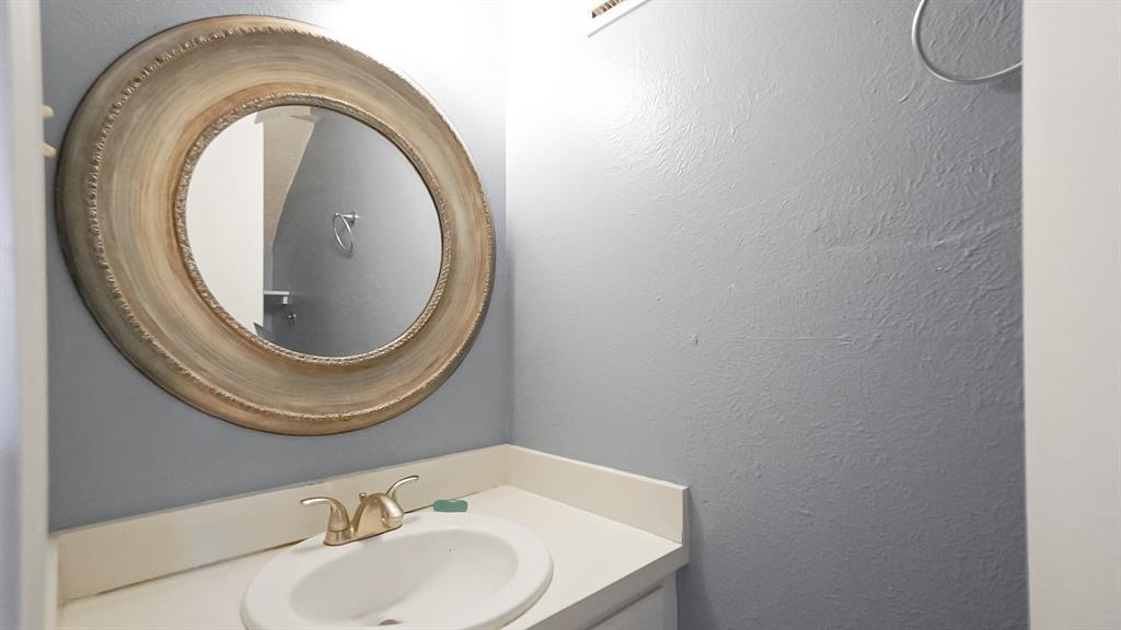 12921 Abrams Road, Unit 505 Dallas, TX 75243 - Photo 10 of 24 Bathroom with vanity and a textured wall