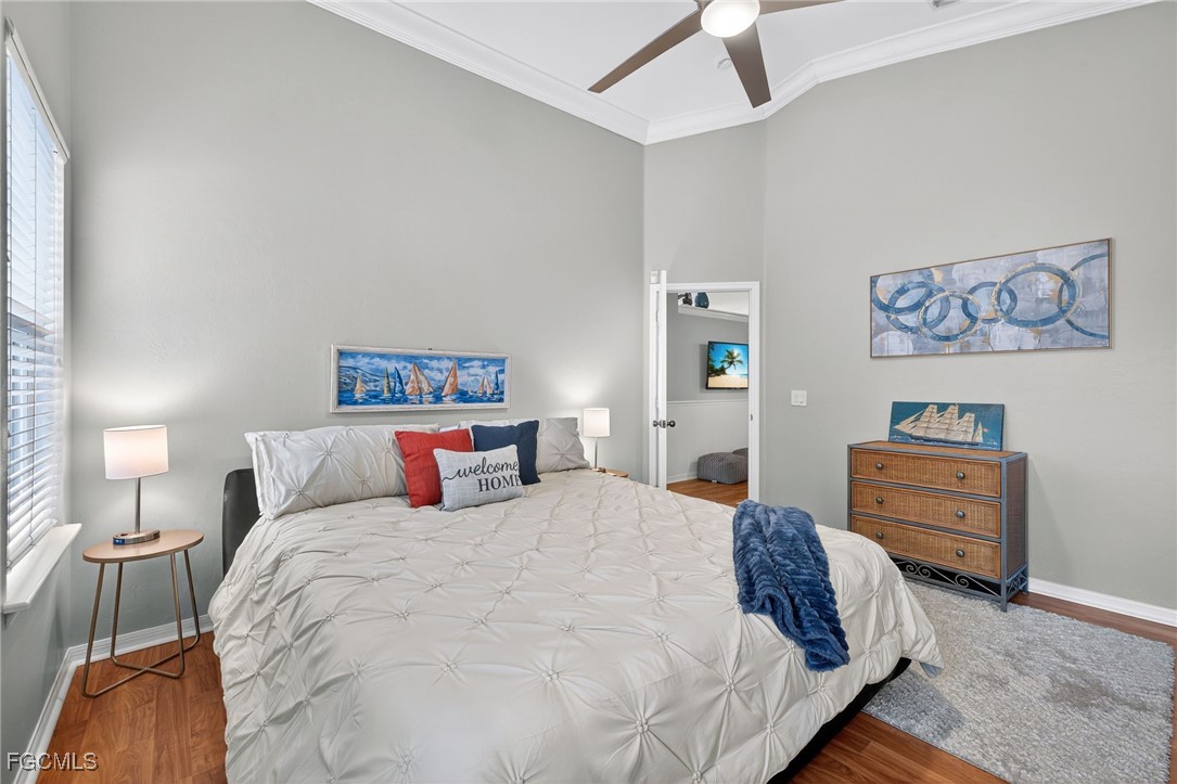 17974 Oakmont Ridge Circle Fort Myers, FL 33967 - Photo 15 of 35 a bedroom with a bed and dresser