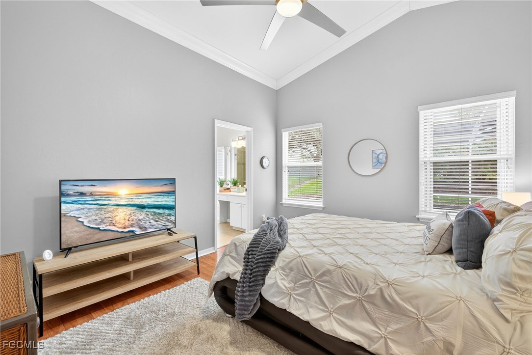 17974 Oakmont Ridge Circle Fort Myers, FL 33967 - Photo 16 of 35 a bedroom with a bed and windows