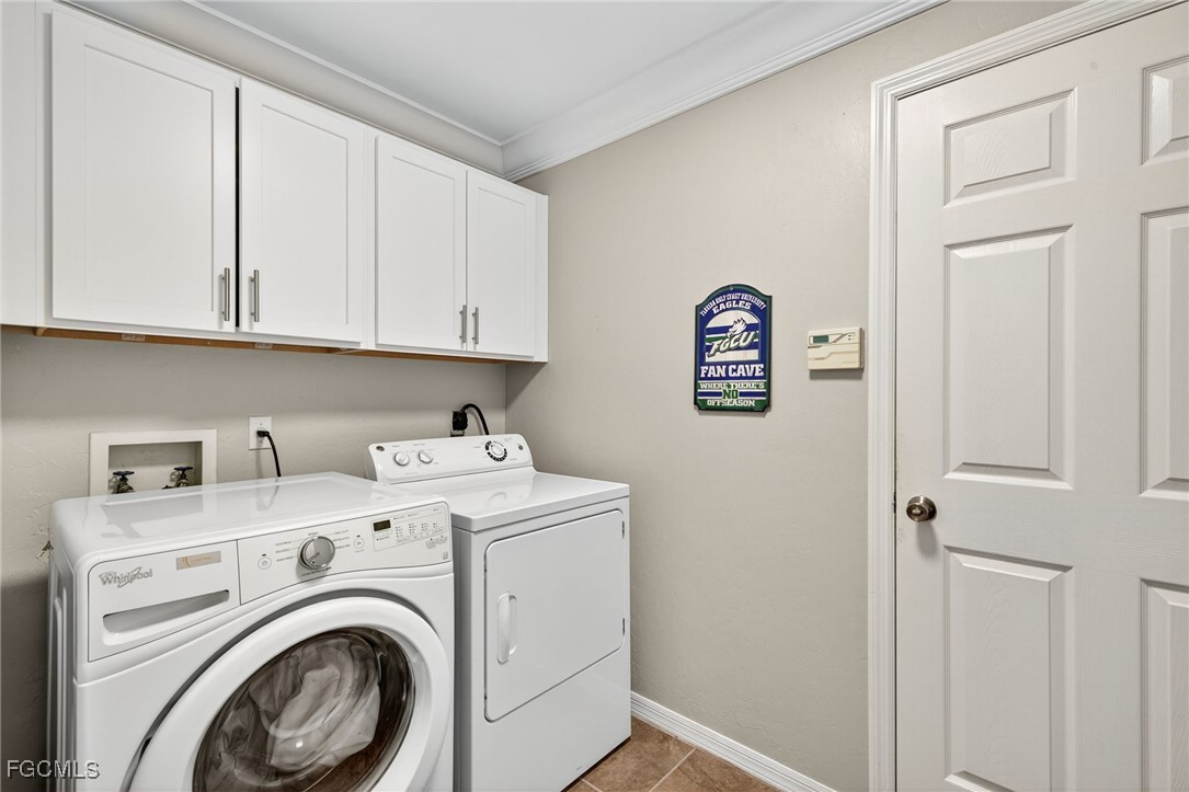 17974 Oakmont Ridge Circle Fort Myers, FL 33967 - Photo 22 of 35 a view of storage and utility room with washer and dryer