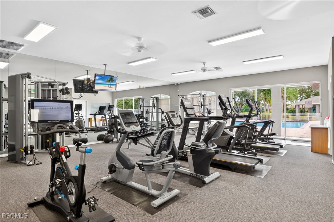17974 Oakmont Ridge Circle Fort Myers, FL 33967 - Photo 34 of 35 a view of a room with gym equipment