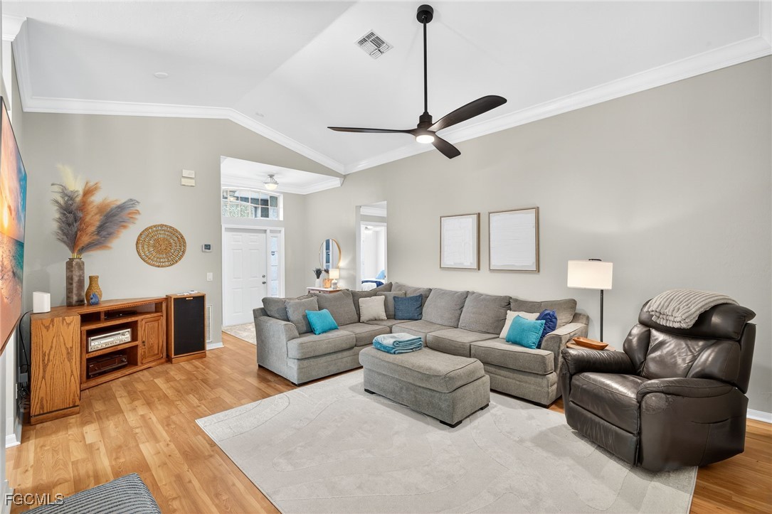 17974 Oakmont Ridge Circle Fort Myers, FL 33967 - Photo 4 of 35 a living room with furniture and wooden floor