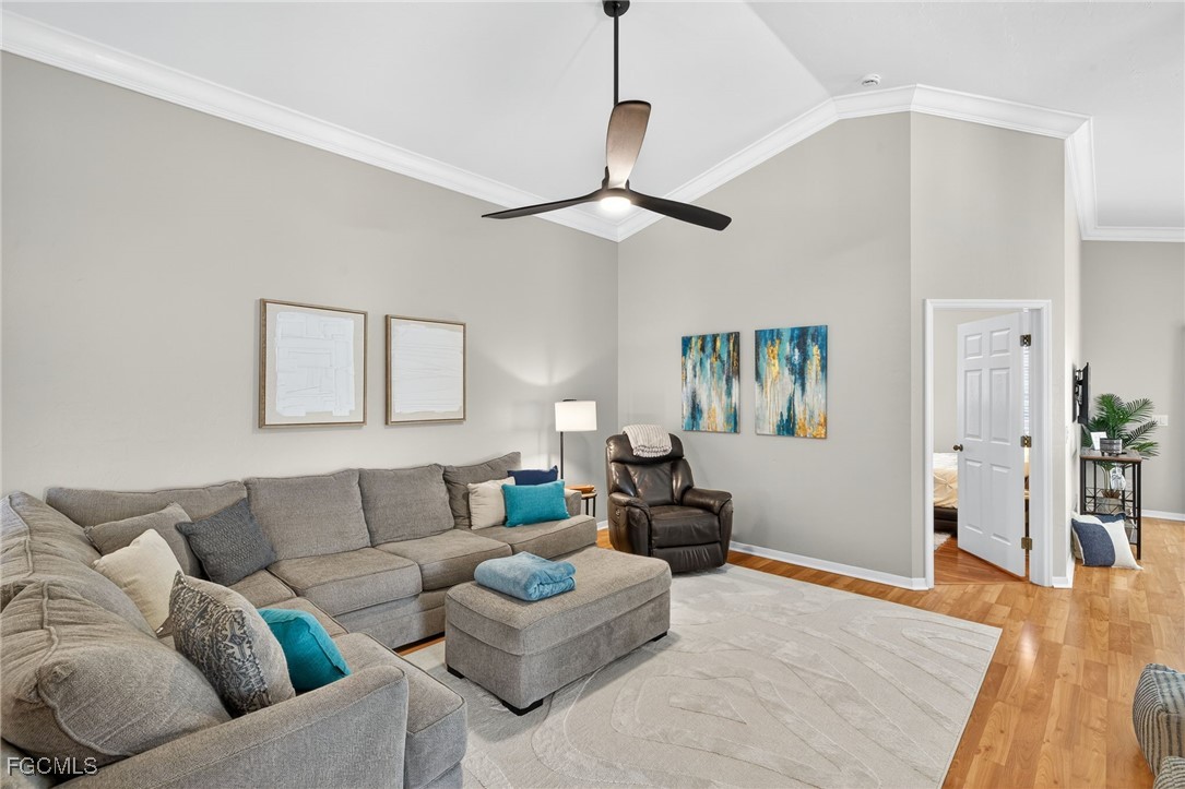 17974 Oakmont Ridge Circle Fort Myers, FL 33967 - Photo 5 of 35 a living room with furniture and a wooden floor