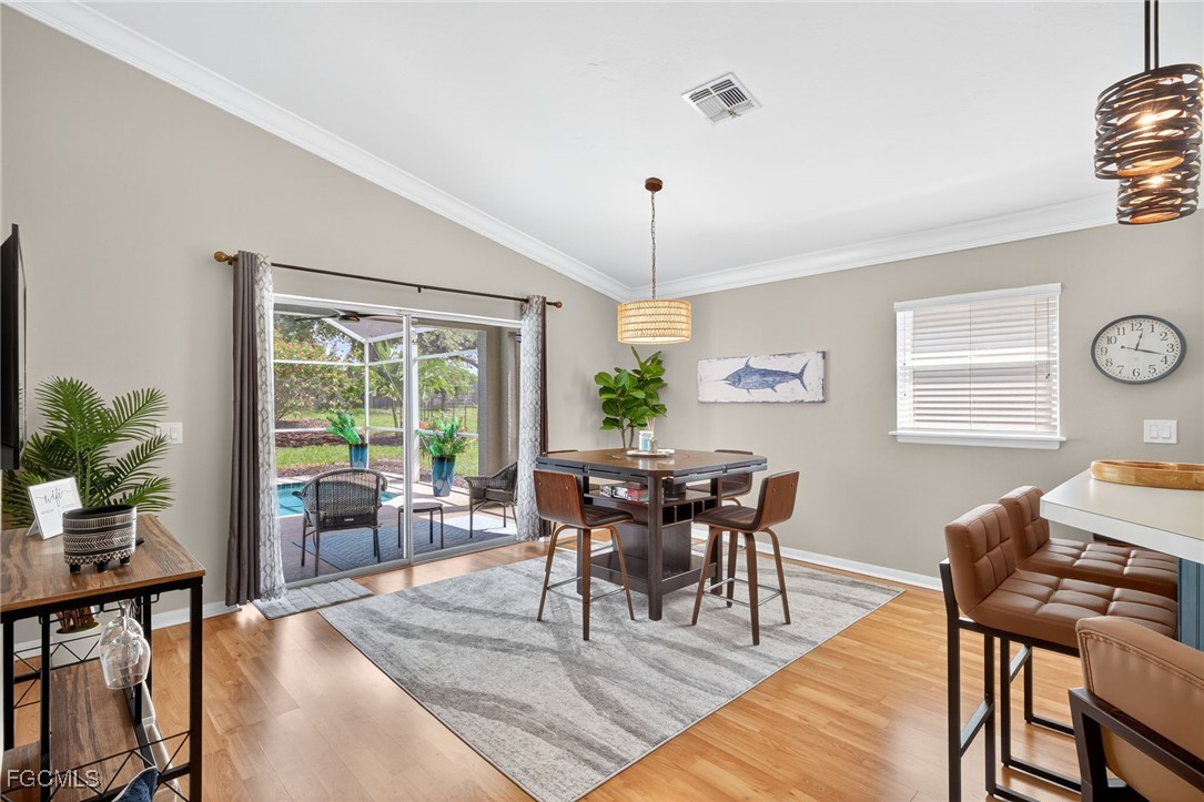 17974 Oakmont Ridge Circle Fort Myers, FL 33967 - Photo 8 of 35 a view of a dining room with furniture window and wooden floor