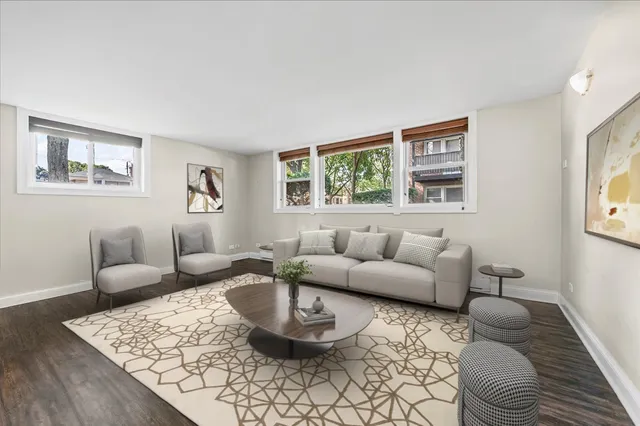 a living room with furniture and a rug