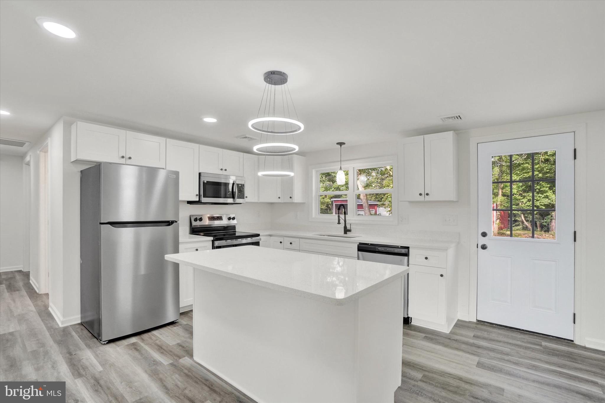 761 2nd Avenue Manchester, PA 17345 - Photo 8 of 29 a kitchen with a refrigerator a sink dishwasher with a stove and refrigerator