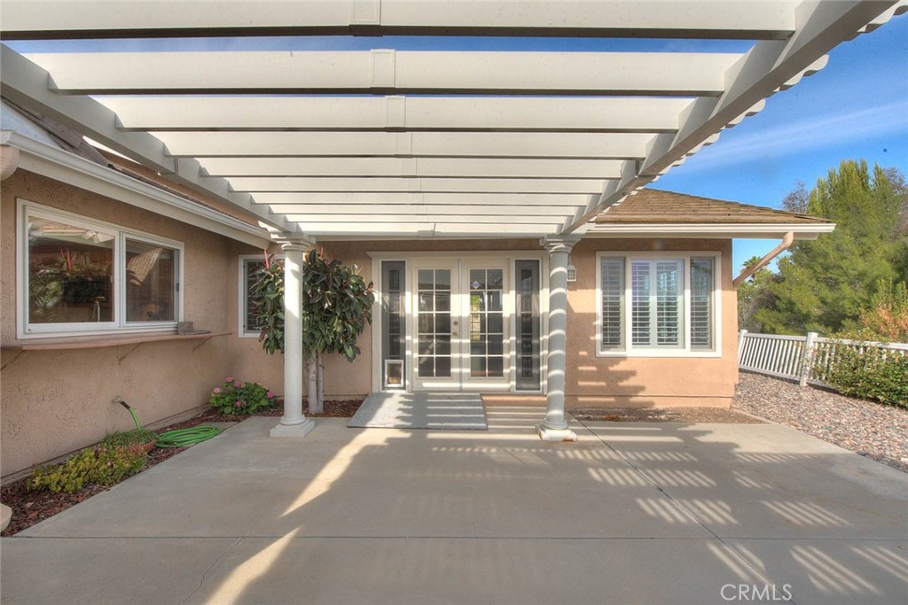 30673 Del Rey Road Temecula, CA 92591 - Photo 34 of 47 Double Door Entry From Bonus Room To Rear Patio. Patio Cover Has Electrical Power And Has Been Freshly Painted. Also All The Windows Have Been Upgraded To Vinyl Windows.