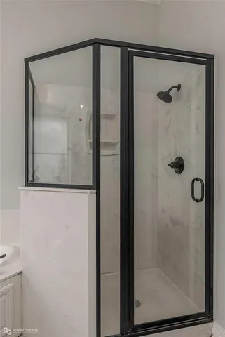 a bathroom with a toilet a sink and shower