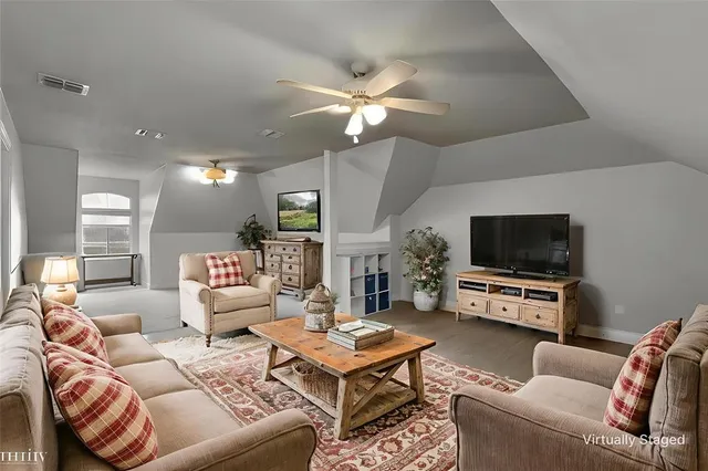an aerial view of a house with a swimming pool and garden