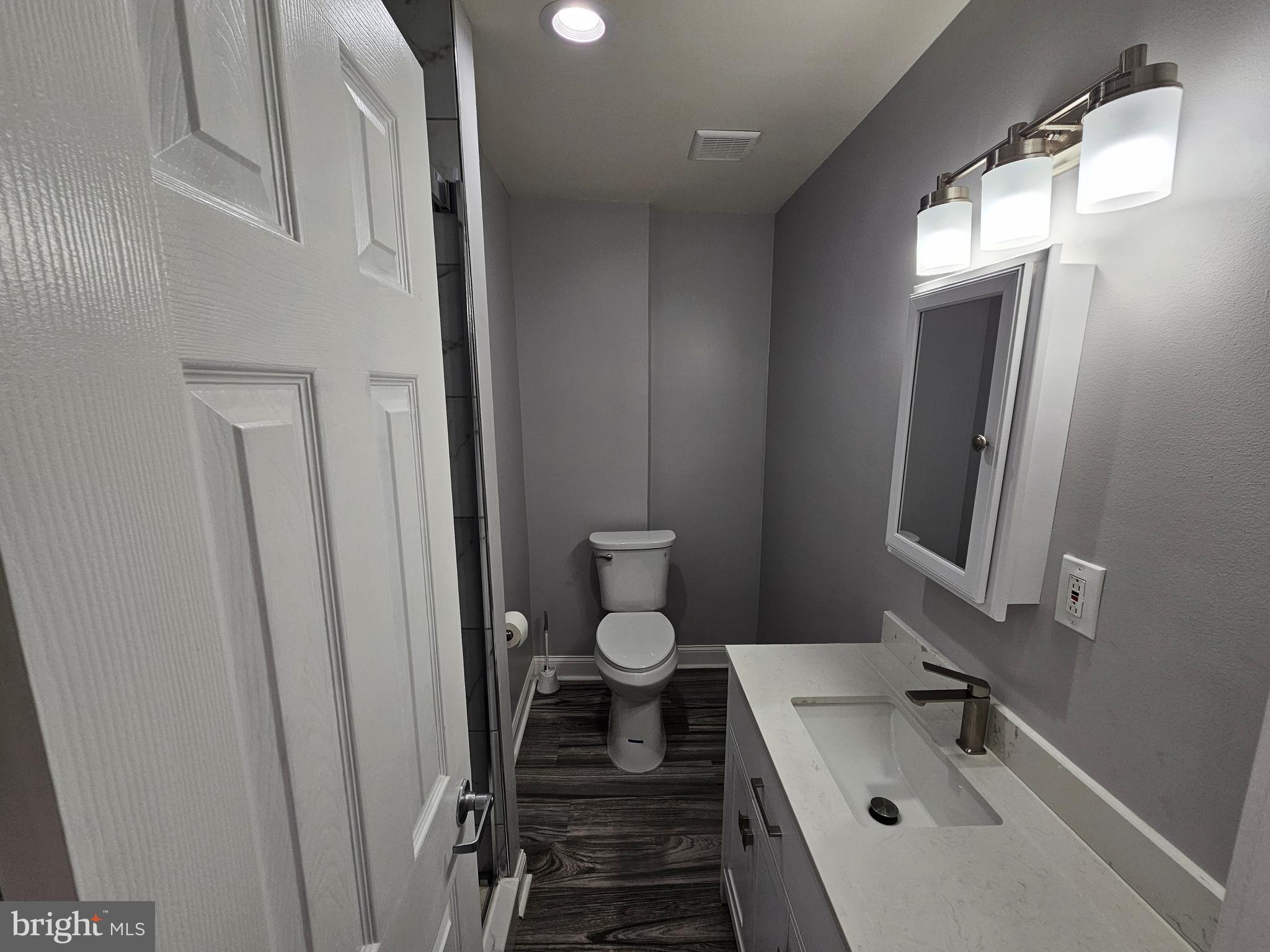 835 East State Street, Unit 2 Trenton, NJ 08609 - Photo 11 of 18 a bathroom with a sink and a mirror