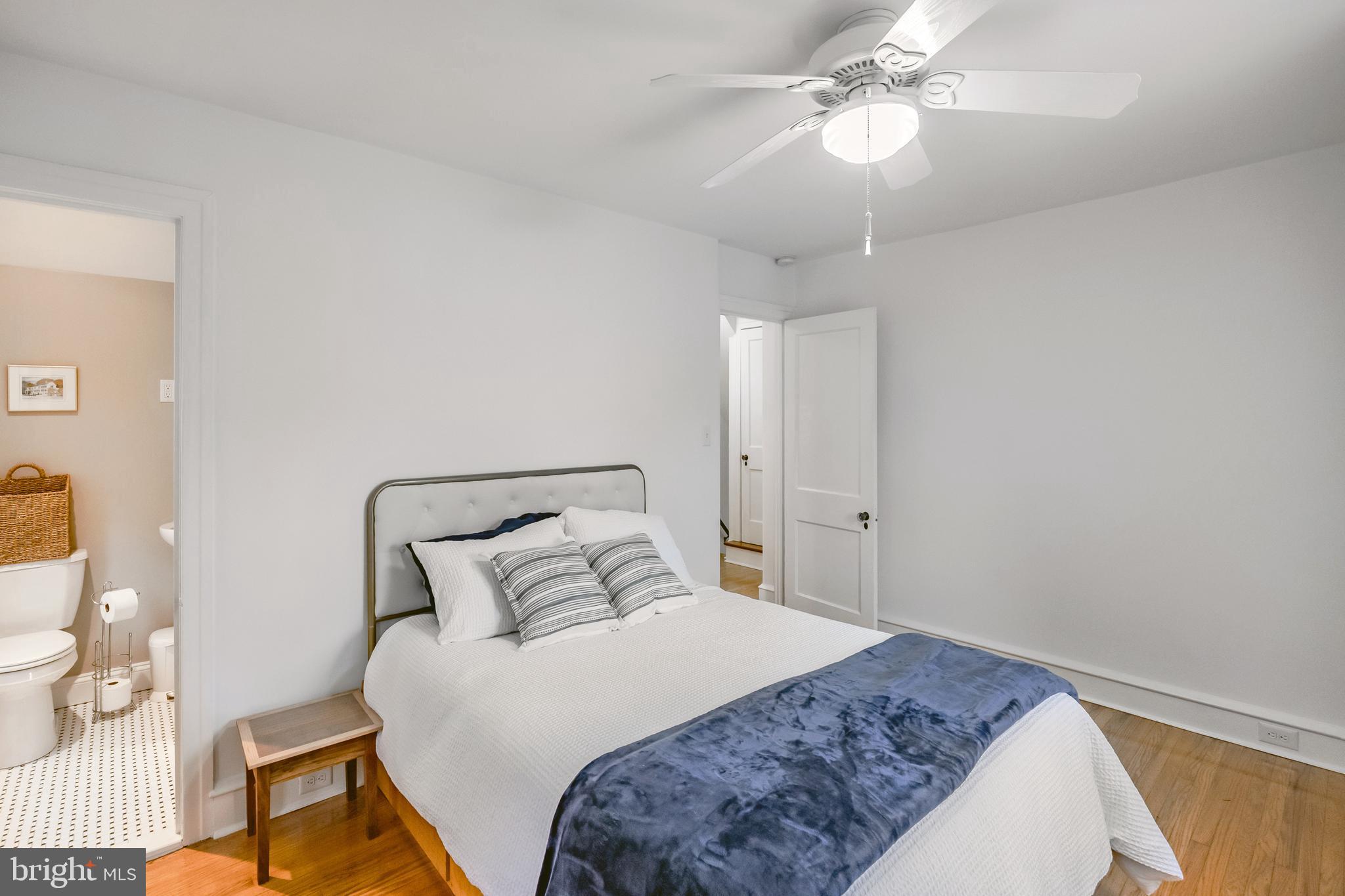 239 Cherry Lane Havertown, PA 19083 - Photo 23 of 49 a bedroom with a bed and a chandelier