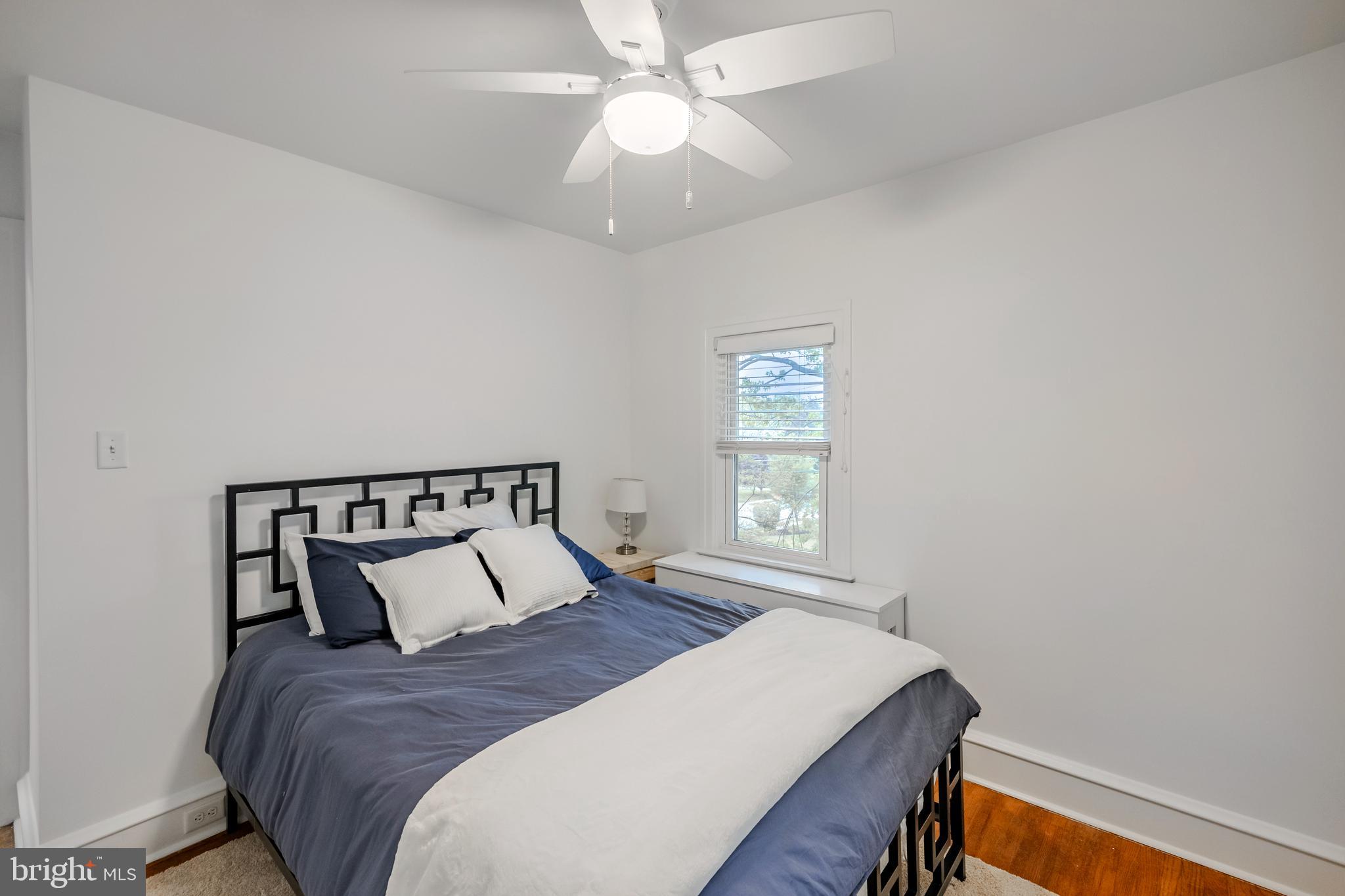 239 Cherry Lane Havertown, PA 19083 - Photo 31 of 49 a bed sitting in a bedroom next to a window