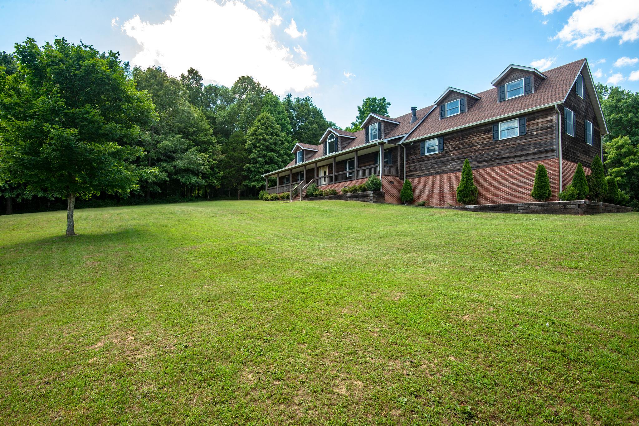 410 Baker Road Dickson, TN 37055 - Photo 1 of 30 a view of a house with a backyard