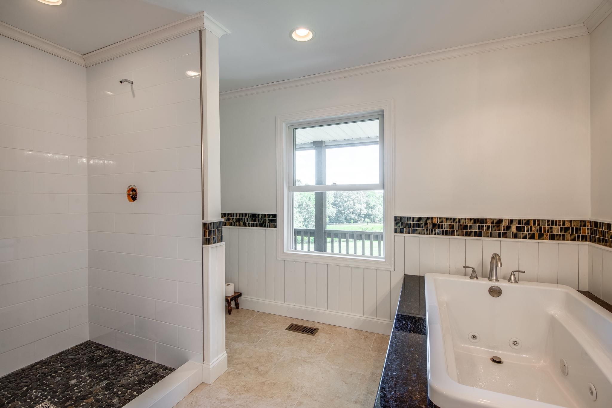 410 Baker Road Dickson, TN 37055 - Photo 20 of 30 a bathroom with a bathtub and a sink