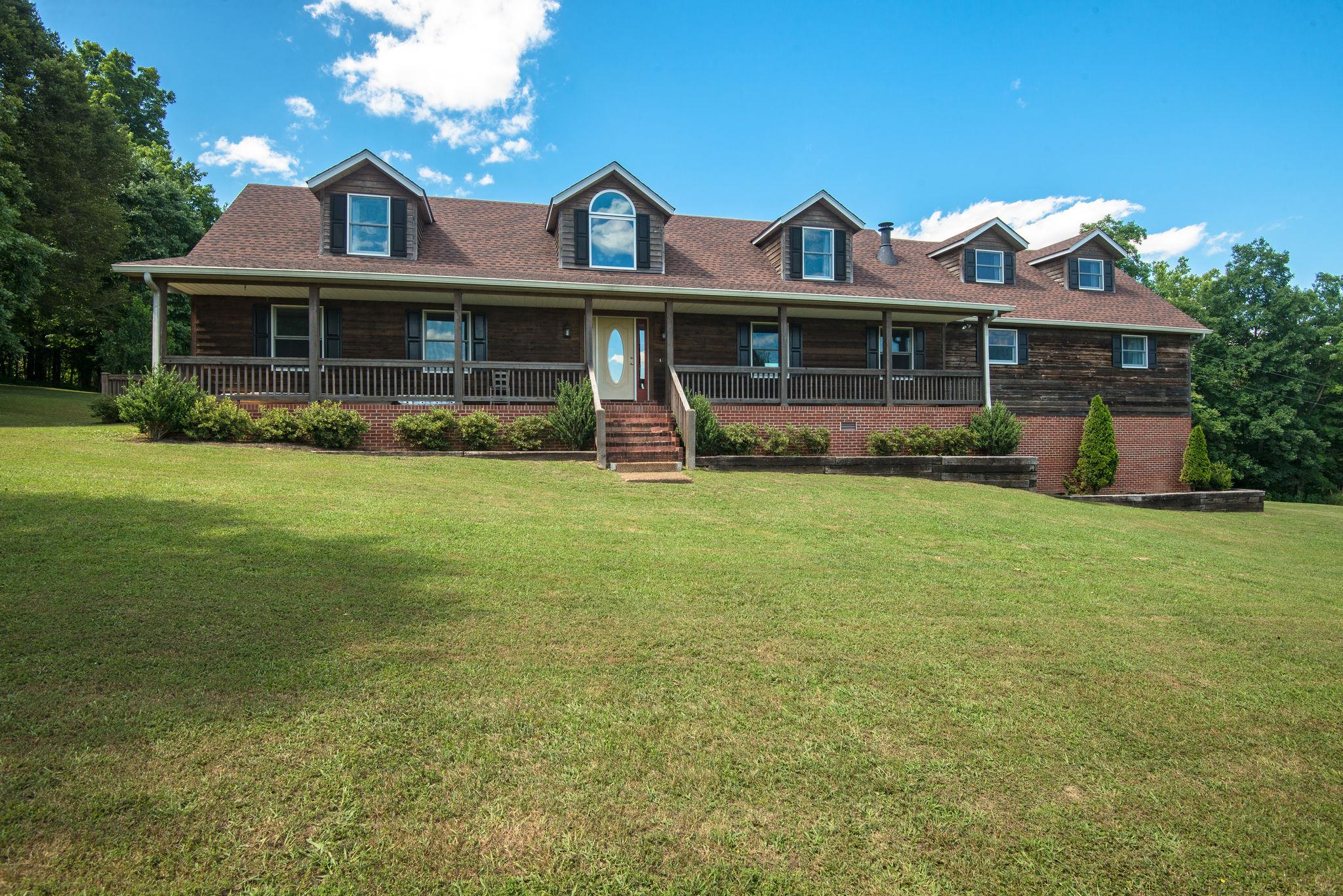 410 Baker Road Dickson, TN 37055 - Photo 2 of 30 a front view of a house with garden