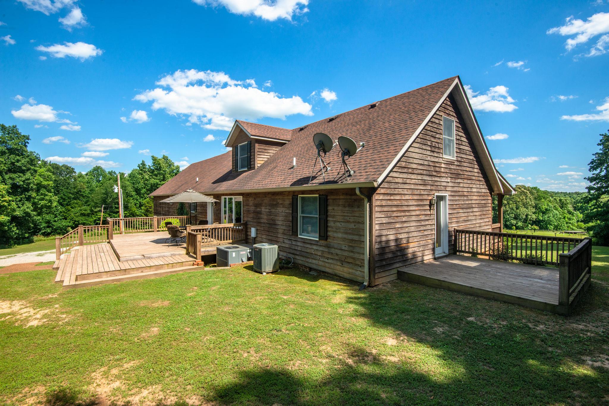 410 Baker Road Dickson, TN 37055 - Photo 4 of 30 a view of a house with a yard patio and sitting area