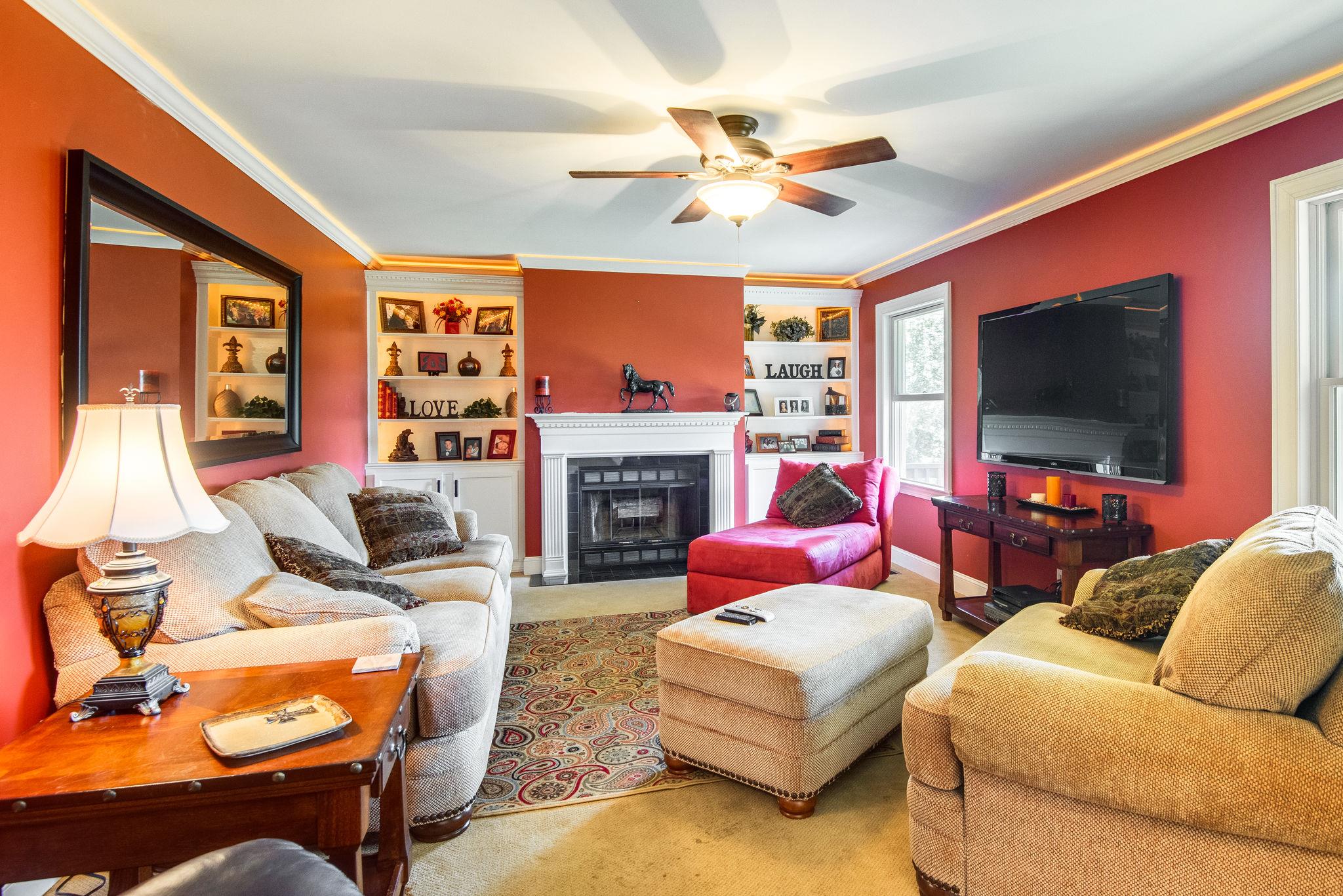 410 Baker Road Dickson, TN 37055 - Photo 10 of 30 a living room with furniture a flat screen tv and a fireplace