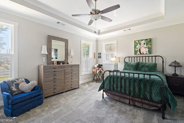 a bed room with furniture and a window