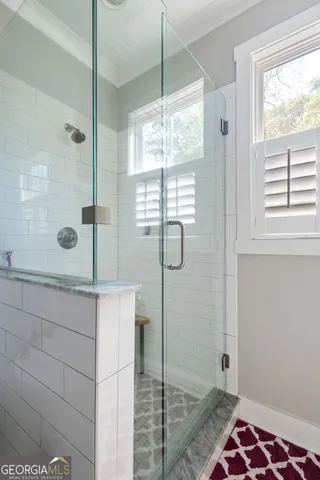 a bathroom with a tub and a shower