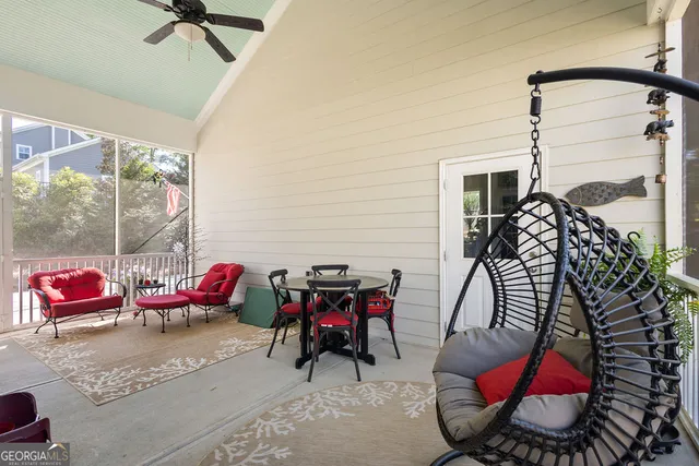a backyard of a house with table and chairs