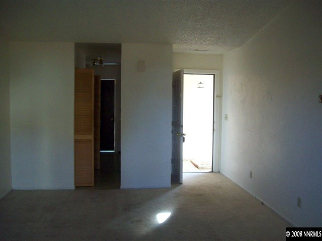 10013 Humite Lane Reno, NV 89506 - Photo 3 of 9 a view of empty room with closet