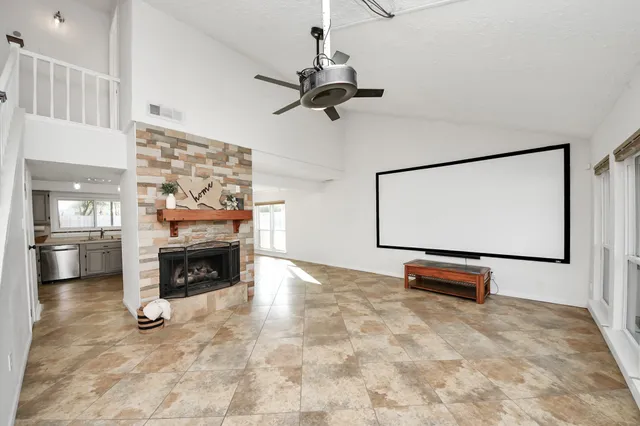 a view of livingroom with fireplace and window